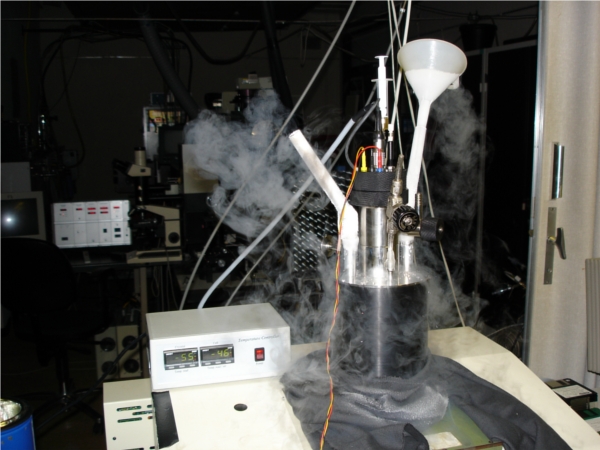 detail of the electrochemical cell with clouds of water vapour produced by the liquid nitrogen refrigerator