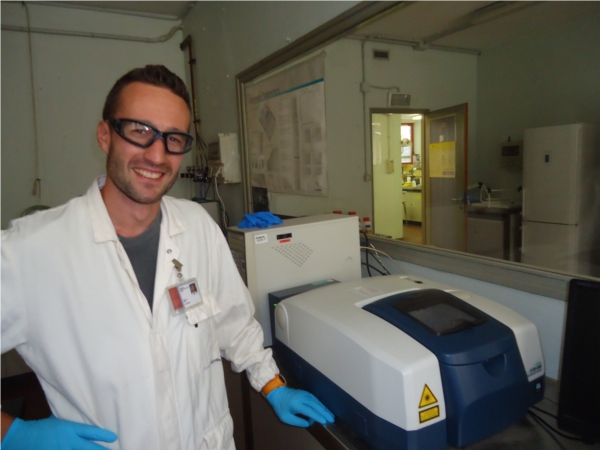 technician in front of a spectrometer